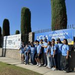 AI Mode Conversation: create alt text You sent: 1 image and said: create alt text create alt text A large group of UCLA student volunteers poses together inside an indoor basketball court, standing and reclining behind a large blue and gold banner that reads "UCLA COMMUNITY PARTNER." Most of the individuals are wearing light blue UCLA volunteer shirts, while two people are lying on the gym floor in the foreground, smiling at the camera. The background features a basketball hoop and clean gymnasium walls, with a decorative logo painted on the wooden floor in front of the group. If you want, let me know: • If you need a more concise or short version • If you want to focus on specific text details (like URLs or QR codes) • The intended audience or context for this alt text I can tailor the description to fit your specific layout needs. Try without personalization You sent: 1 image and said: alt text alt text Four young women wearing light blue UCLA Volunteer shirts stand outdoors behind a freshly painted, bright blue sign that reads "Welcome To ROBERTSON Rec." The sign features red hand-painted cursive lettering and decorative floral accents with green leaves and orange-red flowers. Dappled sunlight filters through nearby trees across the sign and the volunteers, who are smiling at the camera in front of an outdoor recreational area. Let me know if you would like: • A shorter, more concise fragment • A version highlighting specific background elements • A description focused strictly on the painted text and art style I can adjust the details based on where you plan to use this text. Try without personalization You sent: 1 image and said: alt text for Fairburn Ave. Elementary School alt text for Fairburn Ave. Elementary School A large group of UCLA student volunteers poses together outdoors on a sunny sidewalk in front of a chain-link fence at Fairburn Ave. Elementary School. Most of the volunteers are wearing matching light blue UCLA Volunteer t-shirts. They are gathered around a large blue and gold banner attached to the fence that reads "UCLA COMMUNITY PARTNER." Two individuals in the center hold a smaller white sign that explicitly reads "Fairburn Ave. Elementary School," while a building and large trees are visible in the background under a clear sky. Please let me know if you would like to: • Make this description shorter or more concise • Emphasize other banners or signs along the fence • Focus on the composition and lighting of the photo I can easily refine the text to match your website formatting. Try without personalization You sent: 1 image and said: alt text, mayor bass and brentwood council tree planting alt text, mayor bass and brentwood council tree planting A large group of UCLA student volunteers and community members pose together on a black parade float during the Brentwood Bash street festival. They are holding a large blue and gold banner that reads "UCLA COMMUNITY PARTNER" with the website URL "communitypartnerships.ucla.edu" and a QR code printed along the bottom edge. Most individuals are wearing light blue UCLA volunteer shirts. Los Angeles Mayor Karen Bass stands near the center of the group, smiling alongside the volunteers. A large arrangement of blue and white balloons arches behind the group against a bright, clear blue sky, while city buildings and a traffic light are visible in the background. Please let me know if you would like to: • Make this description shorter or more concise • Focus more on Mayor Bass or specific city background details • Adjust the formatting to match a specific web design standard I can quickly update the text to suit your exact platform needs. AI can make mistakes, so double-check responses Try without personalization • Instagram Brentwood showed up! The first-ever Brentwood Bash was a ... Sep 26, 2026 — 243 likes, 7 comments - councilwomantracipark on September 26, 2026: "Brentwood showed up! The first-ever Brentwood Bash was a hug... • Facebook It was such an honor to join Mayor Karen Bass today for the ... It was such an honor to join Mayor Karen Bass today for the launch of her new Climate Action Plan! We are committed to implementin... • www.instagram.com Community Service Commission | It's time for director introductions ... May 16, 2023 — Brentwood Council Tree Planting The Brentwood ... 2025-26 Executive Team and our Fall 2026 goals, at: ... Created by Mayor Bass (@ shorter A large group of UCLA student volunteers and Los Angeles Mayor Karen Bass smile together on a street parade float behind a blue and gold banner reading "UCLA COMMUNITY PARTNER." An arch of blue and white balloons decorates the background under a clear sky. Let me know if you would like to: • Make it even more concise (under 100 characters) • Omit the balloon and background description • Format it as a single short sentence I can refine it further to fit your exact specifications. Try without personalization You sent: 1 image and said: alt text alt text A group of UCLA student volunteers wearing light blue shirts poses on a city street alongside a man in a white button-down shirt. Two volunteers in the front hold a white sign that reads "Brentwood Community Council." A "Burger Lounge" storefront serves as the background under bright, direct sunlight. Let me know if you would like to: • Make it shorter or more concise • Focus on the details of the storefront background • Structure it as a single punchy sentence I can adjust it to perfectly fit your image layout needs. Try without personalization You sent: 1 image and said: alt text alt text A group of UCLA student volunteers poses together on a brick courtyard under a covered walkway at Warner Avenue Elementary School. They are holding a large blue and gold banner that reads "UCLA COMMUNITY PARTNER" along with a website URL and a QR code. Most of the volunteers are wearing light blue UCLA volunteer shirts. The background features a colorful, tiled mosaic wall and a sign reading "Warner Avenue," with a blue school banner displaying acronym values hanging overhead. Let me know if you would like to: • Make this description shorter or more concise • Emphasize specific text like the school's acronym values • Structure it as a single punchy sentence I can tailor the text to perfectly match your site's formatting. Try without personalization You sent: 1 image and said: alt text alt text A group of UCLA student volunteers wearing light blue shirts gathers outdoors in a paved parking lot area to receive instructions before a community service event. An organizer stands near a stack of cardboard boxes and tables laden with packaged food and supplies under a blue pop-up tent, gesturing with her hands as she speaks to the attentive crowd. Large, mature trees provide partial shade over the gathering on a bright, sunny day. Let me know if you would like to: • Make this description shorter or more concise • Focus on a specific part of the group or the supplies • Structure it as a single punchy sentence I can adjust it to match the rest of your website's image tags perfectly. Try without personalization You sent: 1 image and said: alt text for Sunland Tujunga Community Tree Planting alt text for Sunland Tujunga Community Tree Planting A group of UCLA student volunteers poses together outdoors under red event tents during the Sunland-Tujunga community tree planting event. Most of the volunteers are wearing matching light blue UCLA Volunteer t-shirts while holding a large blue and gold banner that reads "UCLA COMMUNITY PARTNER." The red pop-up tents in the background feature the website URL "www.monicarodriguez.org" alongside the City of Los Angeles seal, all under a clear blue sky. Please let me know if you would like to: • Make this description shorter or more concise • Highlight Councilmember Monica Rodriguez's branding specifically • Format it as a single punchy sentence I can adjust the details to perfectly fit your website's layout needs. Try without personalization You sent: 1 image and said: short alt text for Good Earth Community Garden short alt text for Good Earth Community Garden A group of community volunteers poses outdoors behind low garden shrubs at the Good Earth Community Garden. They stand on either side of a large blue and gold banner that reads "UCLA COMMUNITY PARTNER." Green trees, a wooden utility pole, and a clear blue sky are visible in the background. Let me know if you would like to: • Make it even shorter (under 100 characters) • Remove the background elements entirely • Format it as a single punchy sentence I can refine the description to match your specific web layout. Try without personalization You sent: 1 image and said: short alt text short alt text A large group of volunteers poses together on a dirt path in front of a light rail station platform under a clear blue sky. They are holding a large blue and gold banner that reads "UCLA COMMUNITY PARTNER" alongside a small white sign in the foreground reading "Westwood Greenway." Green trees and overhead power lines frame the background of the sunny scene. Let me know if you would like to: • Make it even shorter (under 100 characters) • Remove the mention of the background light rail platform • Format it as a single punchy sentence I can adjust the details to fit your exact web layout needs. Try without personalization You sent: 2 images and said: create very short alt text create very short alt text First Image: UCLA volunteers plant small shrubs in a dirt landscaping bed marked with caution tape and traffic cones. Shady trees and a multi-story building are visible in the background. Second Image: A group of UCLA volunteers poses together on a sunny sidewalk, with some crouching and holding potted plants while making hand signs. Let me know if you would like to: • Combine them into a single summary for a collage • Make them even shorter (under 100 characters each) • Focus on a specific action or individual in either photo I can tweak these descriptions to match your specific layout. Try without personalization You sent: 1 image and said: alt text very short alt text very short UCLA volunteers wearing light blue shirts smile together on a sunny sidewalk in front of a stone wall and black iron fence. They are standing beneath a large blue and gold banner that reads "UCLA COMMUNITY PARTNER" under a clear, bright blue sky with tall green cypress trees.